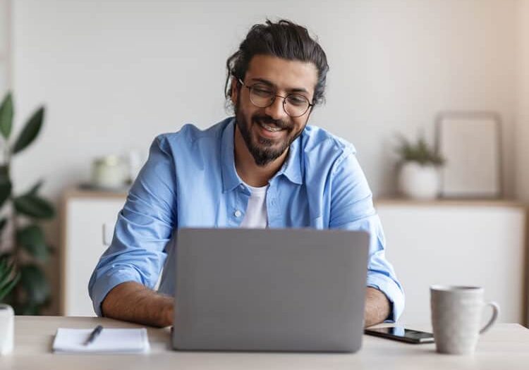 freelance work happy millennial arab man workin