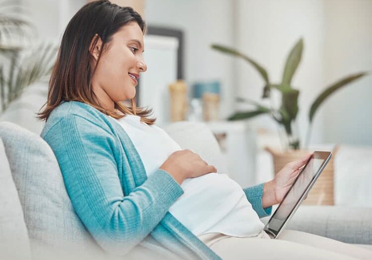 pregnancy planning relax and woman with a tablet pregnancy planning relax and woman with a tablet